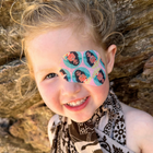 Close up of a smiling girl wearing a Disney Moana eye patch
