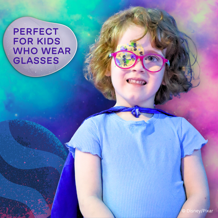 Child wearing an Elio eye patch under pink glasses, perfect for kids who wear glasses