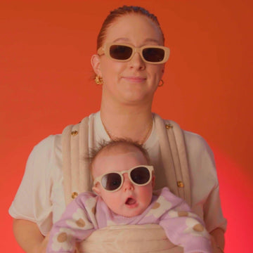 A parent and child wearing sunglasses