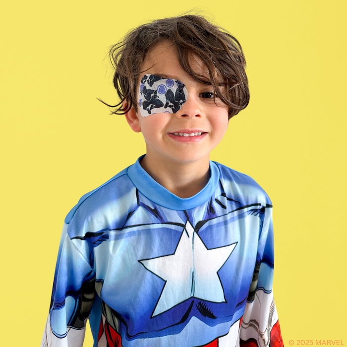 Boy in a Captain America costume wearing a Black Panther eye patch
