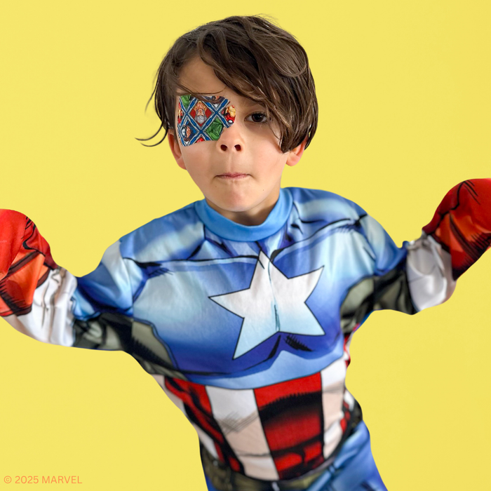 Boy in a Captain America costume wearing a multi-colour Avengers eye patch